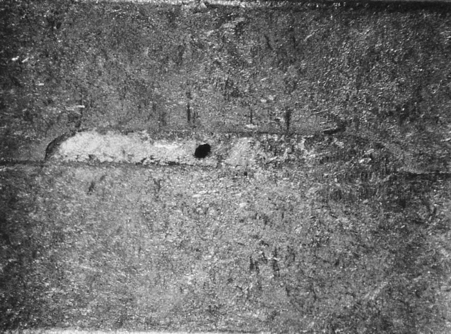 Edge porosity (6.5X).