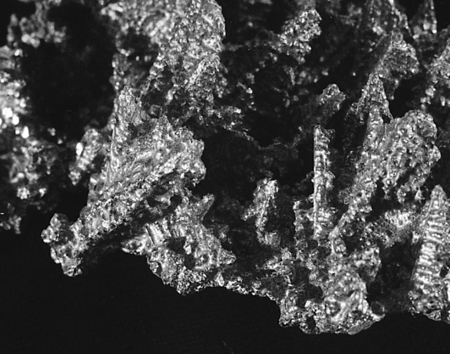 Dendritic primary aluminum crystals which formed during solidification of 380 alloy. These unusually large crystals were formed in a partially filled ladle that was left sitting in the dip well of a furnace. The temperature did not fall below the solidus