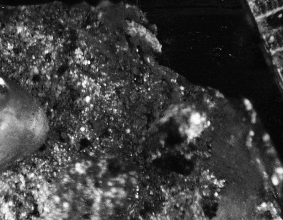 Flux inclusion in the shape of an egg shell, which broke when a fracture was made for examination (15X).