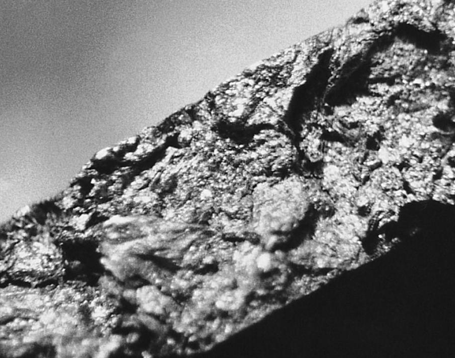 Folds of oxide films, which assist in creating localized shrinkage voids and provides leakage channels through the casting wall (25X).